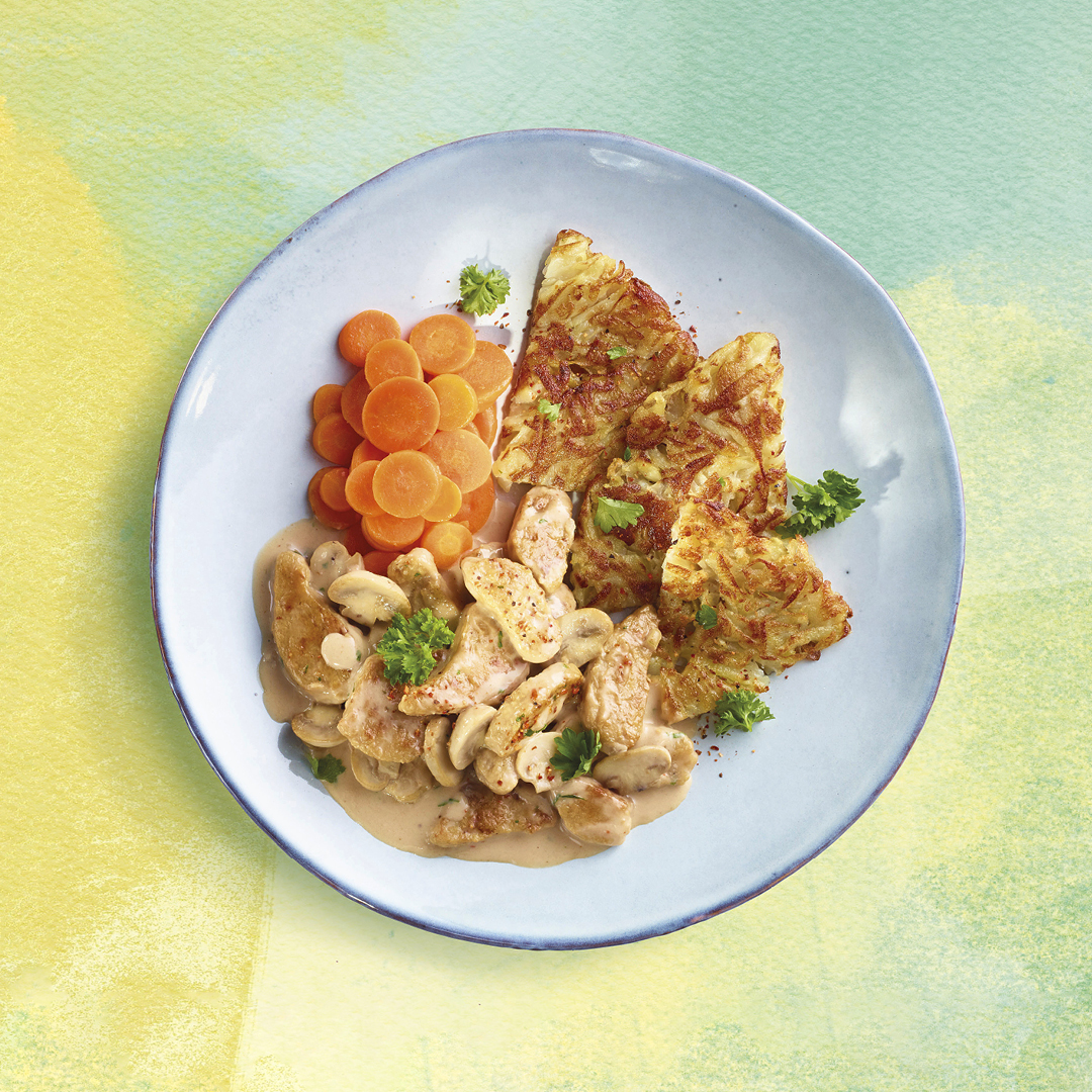 Zürcher Vegic-Geschnetzeltes mit Champignon-Crèmesauce, Rösti und glasierten Rüebli